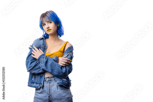 Portrait of young stylish woman posing indenim jacket, blue and yellow tones of clothes in Ukrainian colors style, lady on white isolated background with copy space