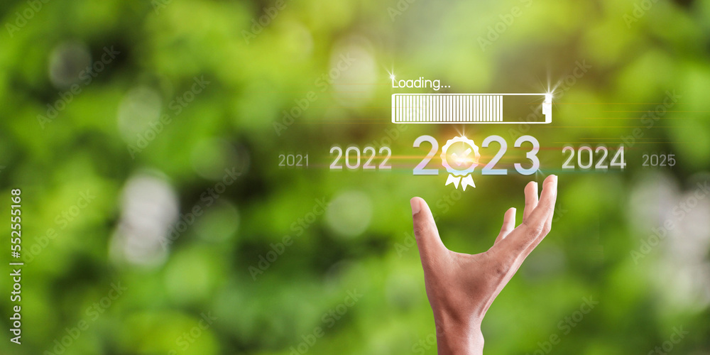 Countdown to 2023 concept. the taps a virtual download bar with a ...