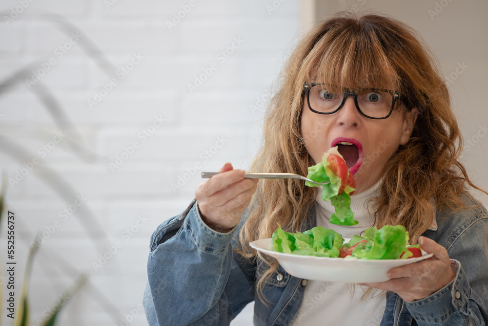 woman with surprise gesture and salad. diet and health concept woman with surprise gesture and salad. diet and health concept