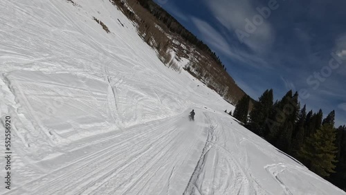Aerial of snowmobile in snowy colorado winter vail pass landscape