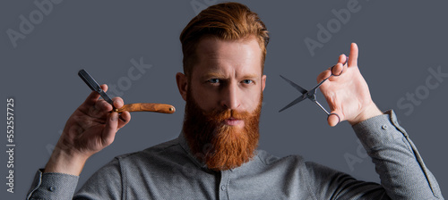 concept of barbershop. face of man barber isolated on grey background. man with barber scissors