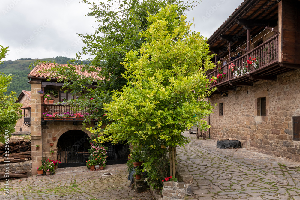 Stone houses and narrow streets in a mountain village in the north of Spain. Barcena Mayor.