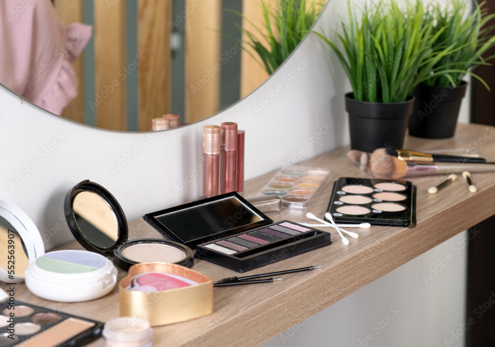 Professional makeup cosmetics on wooden dressing table Stock Photo | Adobe  Stock