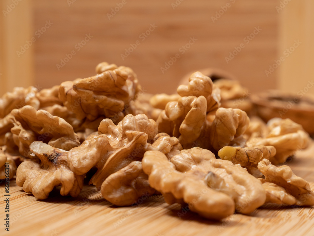 Walnut on a wooden background. Raw walnut. Walnut on a wooden background. Raw walnut.