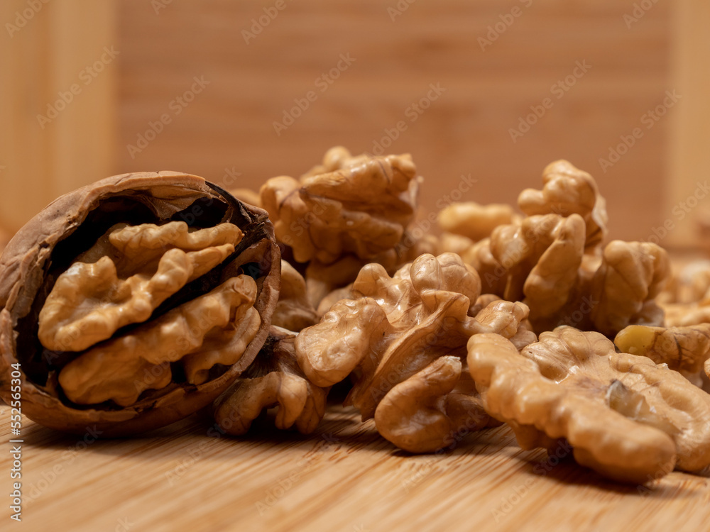 Walnut on a wooden background. Raw walnut. Walnut on a wooden background. Raw walnut.