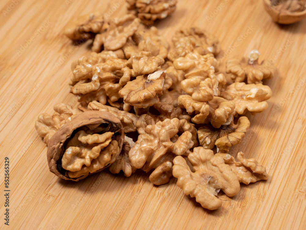 Walnut on a wooden background. Raw walnut. Walnut on a wooden background. Raw walnut.