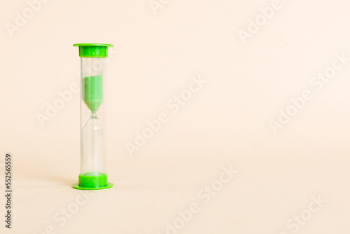 hourglass on the table, sand clock as time passing concept for business deadline, copy space