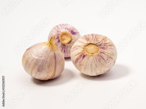 Heads of garlic on a white background.