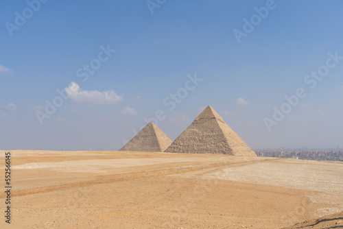 panoramic view of the pyramids of Egypt and the city of Cairo in the background