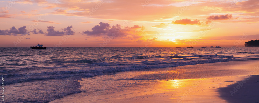 Panoramic coastal landscape with raising sun