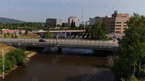 Traffic At The Flag Bridge Over Chena River In Downtown, Fairbanks, Alaska. drone ascend