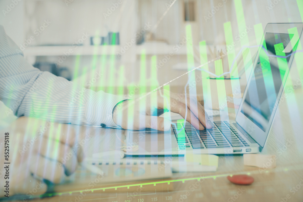 Multi exposure of stock market graph with man working on laptop on background. Concept of financial analysis.