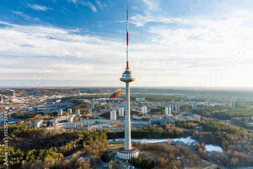 Giant tricolor Lithuanian flag waving on Vilnius television tower on the celebration of Restoration of the State Day.