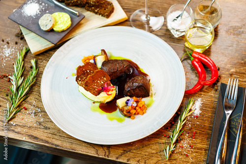 Deer tenderloin. Truffle-potato puree, porcini mushrooms, baked leek and carrot, juniper bread, port wine sauce. Delicious healthy traditional food served for lunch in modern gourmet restaurant