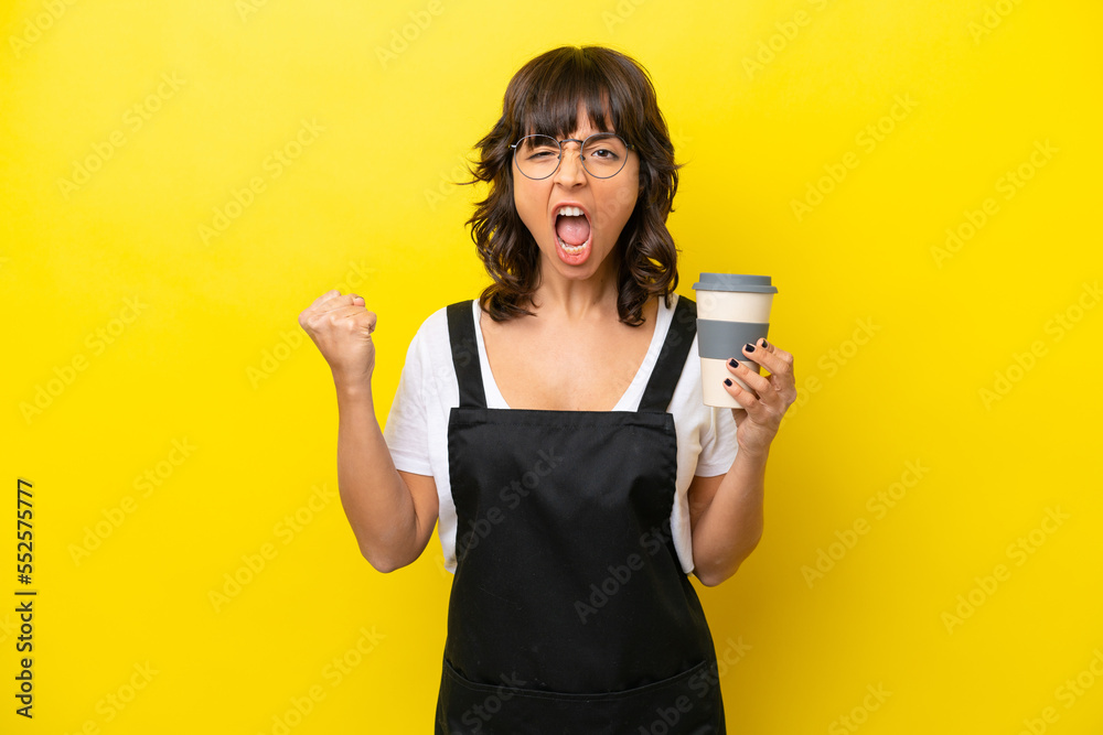 Restaurant waiter latin woman isolated on yellow bakcground Restaurant waiter latin woman isolated on yellow bakcground