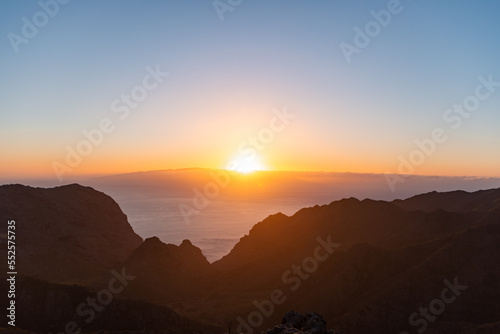 View from a viewpoint of the mountains of Tenerife at sunset overlooking La Gomera