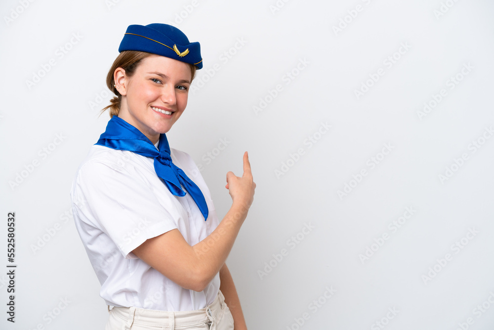 Airplane stewardess woman isolated on white background pointing back Airplane stewardess woman isolated on white background pointing back