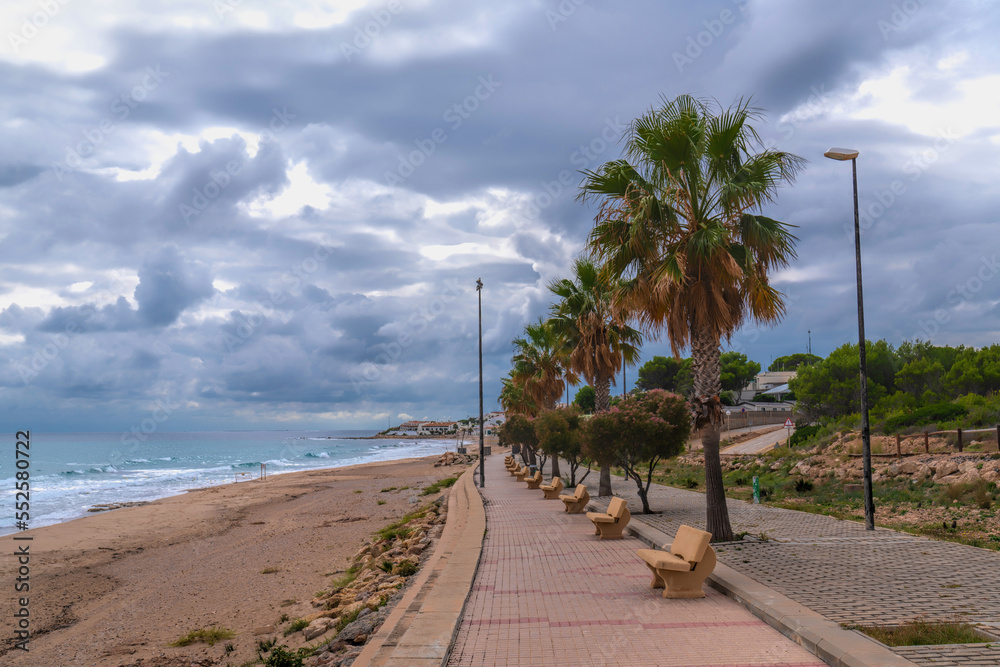L`Almadrava Spain beach promenade and palm trees Costa Dorada Catalonia north of Ebro Delta