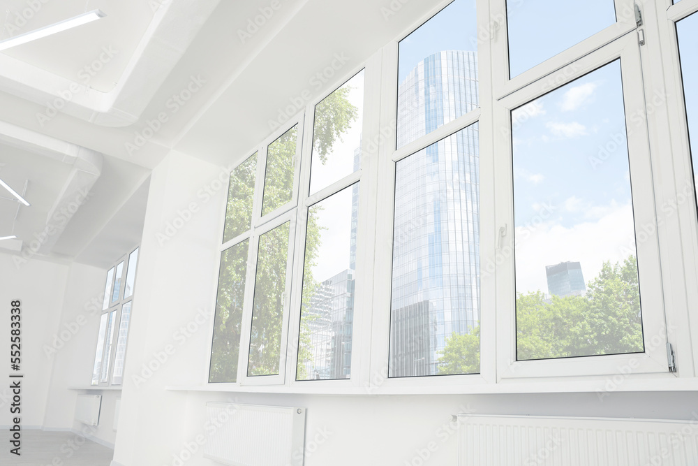 Fototapeta premium Empty office room with clean windows and lighting. Interior design
