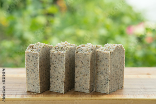 Green handmade scrub soap with wormwood and thyme. photo