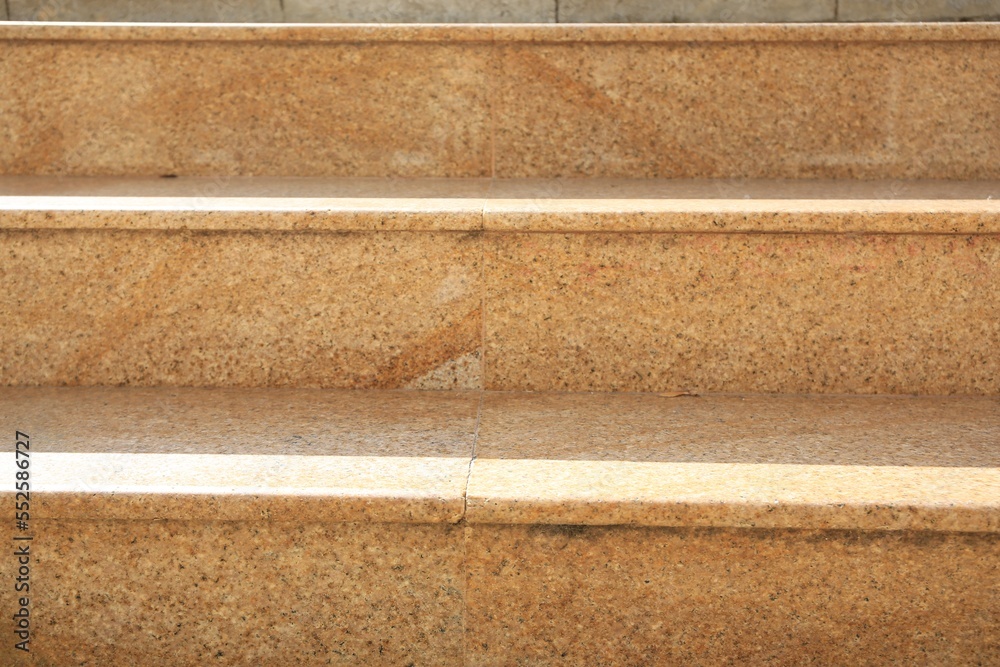 Closeup view of beige stairs outdoors on sunny day