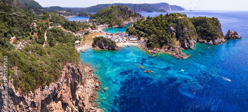 Fototapeta Naklejka Na Ścianę i Meble -  Corfu island. aerial drone view of  most popular and beautiful Paleokastrtsa tourist village and resort, Ampelaki Beach. Greece, ionian islands