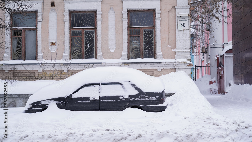 Improperly parked cars create congestion in the city during
heavy snowfall. Snowstorm in the center of the capital. Improperly parked cars create congestion in the city during
heavy snowfall. Snowstorm in the center of the capital.