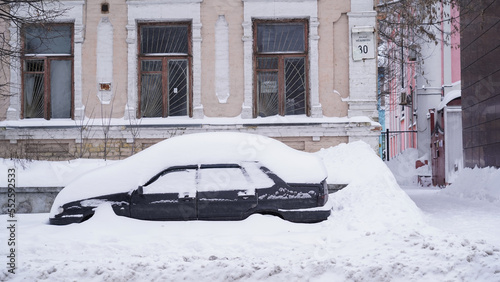 Improperly parked cars create congestion in the city during
heavy snowfall. Snowstorm in the center of the capital.
