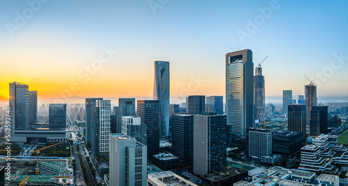Aerial view of city skyline and modern buildings at sunrise in Ningbo, Zhejiang Province, China. East new town of Ningbo, It is the economic, cultural and commercial center of Ningbo City. © ABCDstock
