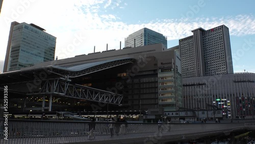Wallpaper Mural UMEDA, OSAKA, JAPAN - SEPTEMBER 2022 : View of Osaka and Umeda train station in sunset. Time lapse shot, dusk to night. Travel and transportation concept video. Torontodigital.ca