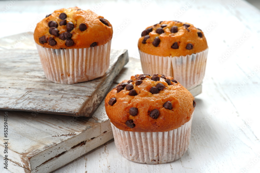 Chocolate chip muffins on white background	