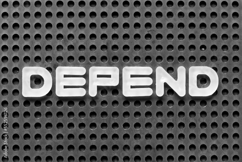 Принти на полотні White alphabet letter in word depend on black pegboard background