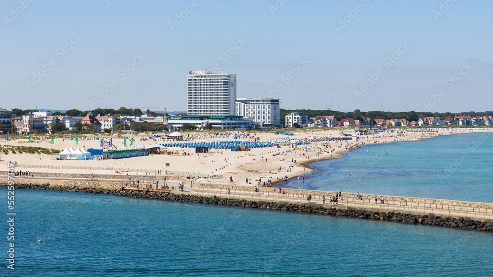 The sand beach in Warnemünde, Rostock in Germany with many tourists on a summer day