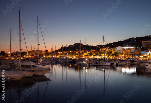Port of Le Lavandou in the evening, France. Luxury yachts and motor boats.