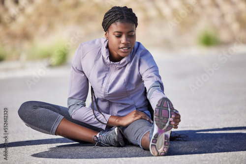 Black woman, fitness and leg stretching in city streets, daily jogging and morning workout training practice. Physical activity, healthy wellness warmup and exercise, sports in road outdoor with girl