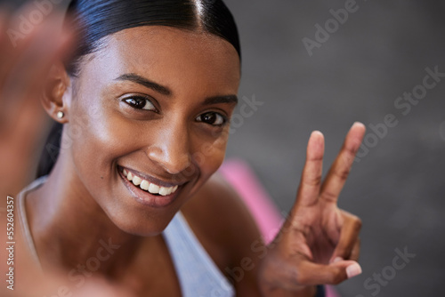 Canvas Print Woman, selfie and peace sign in gym after workout, exercise or training