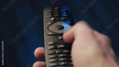 A man using a tv remote console