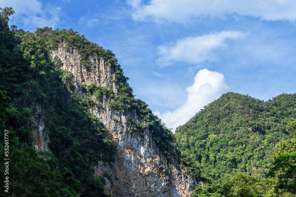 Hill landscape with blue sky and clouds