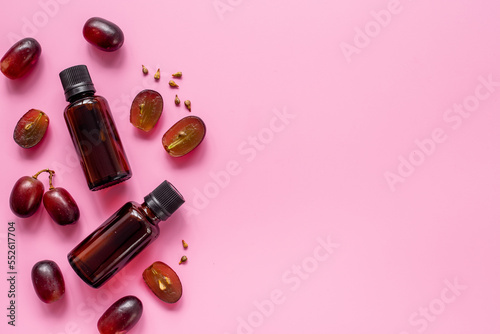 Bottles of grape seed essential oil. Massage body care cosmetic product