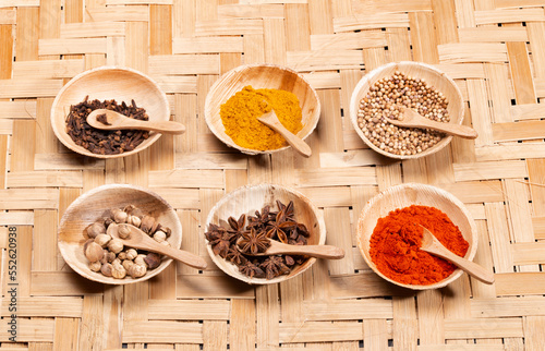 Asian spices, seasonings, and condiment on bamboo. photo