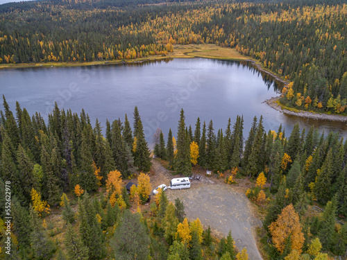 aerial view camping caravan near river autumn fall landscape along Ammarnas National Park in Lapland Sweden photo