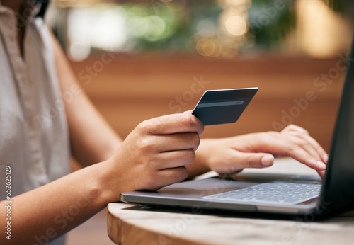 Credit card, woman hands and laptop at cafe for ecommerce payment, fintech money or online shopping. Closeup customer, coffee shop and computer banking, finance and wealth with internet pc technology