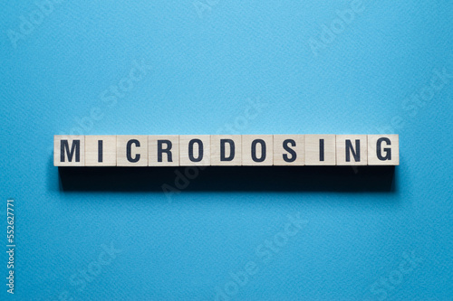 Microdosing - word concept on cubes