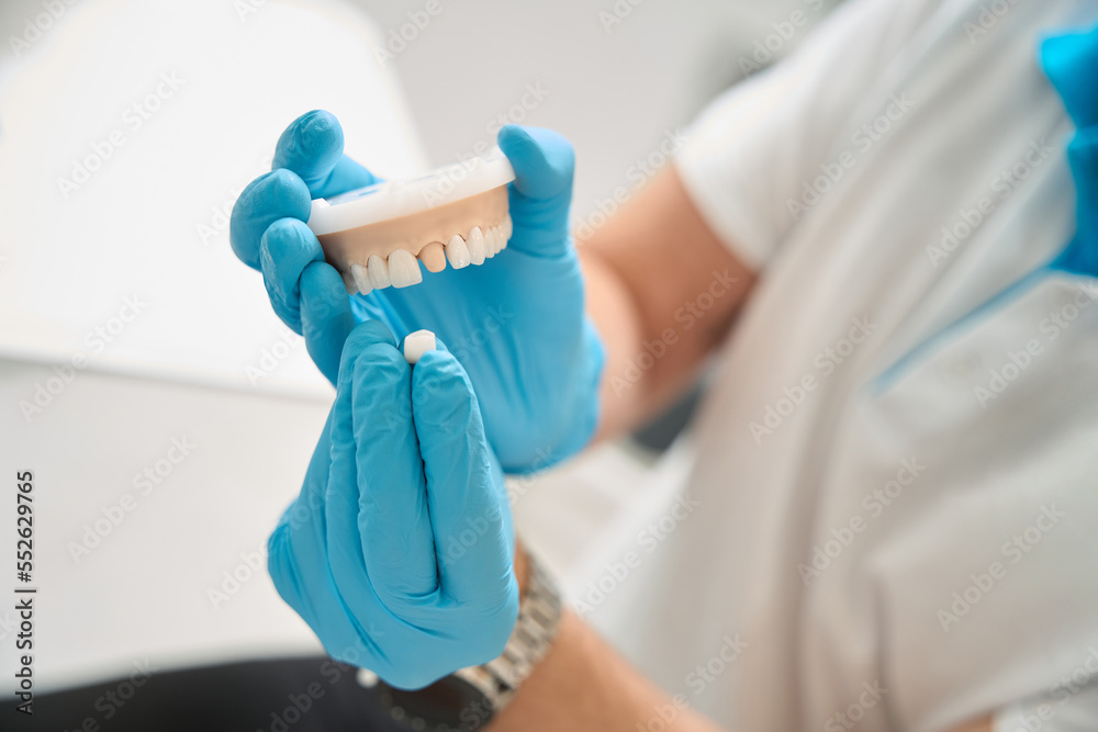Orthodontist preparing to carry out dental procedure