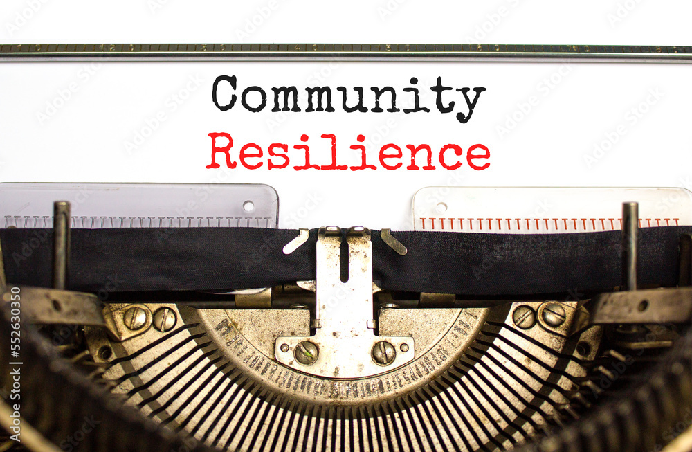 Community resilience symbol. Concept word Community resilience typed on retro old typewriter. Beautiful white background. Business and community resilience concept. Copy space.