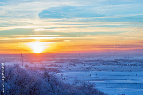 Winter landscape with a beautiful sunset in the countryside