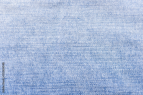 Close up shot of a blue colored jeans texture background.