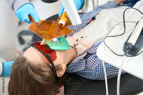 Patient in goggles is given a photopolymer filling photo