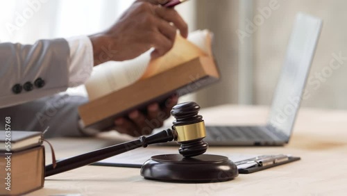 Justice and law concept.Male judge in a courtroom on wooden table and Counselor or Male lawyer working in office. Legal law, advice and justice concept.