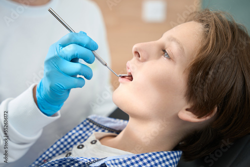 Boy at the reception in the dental office